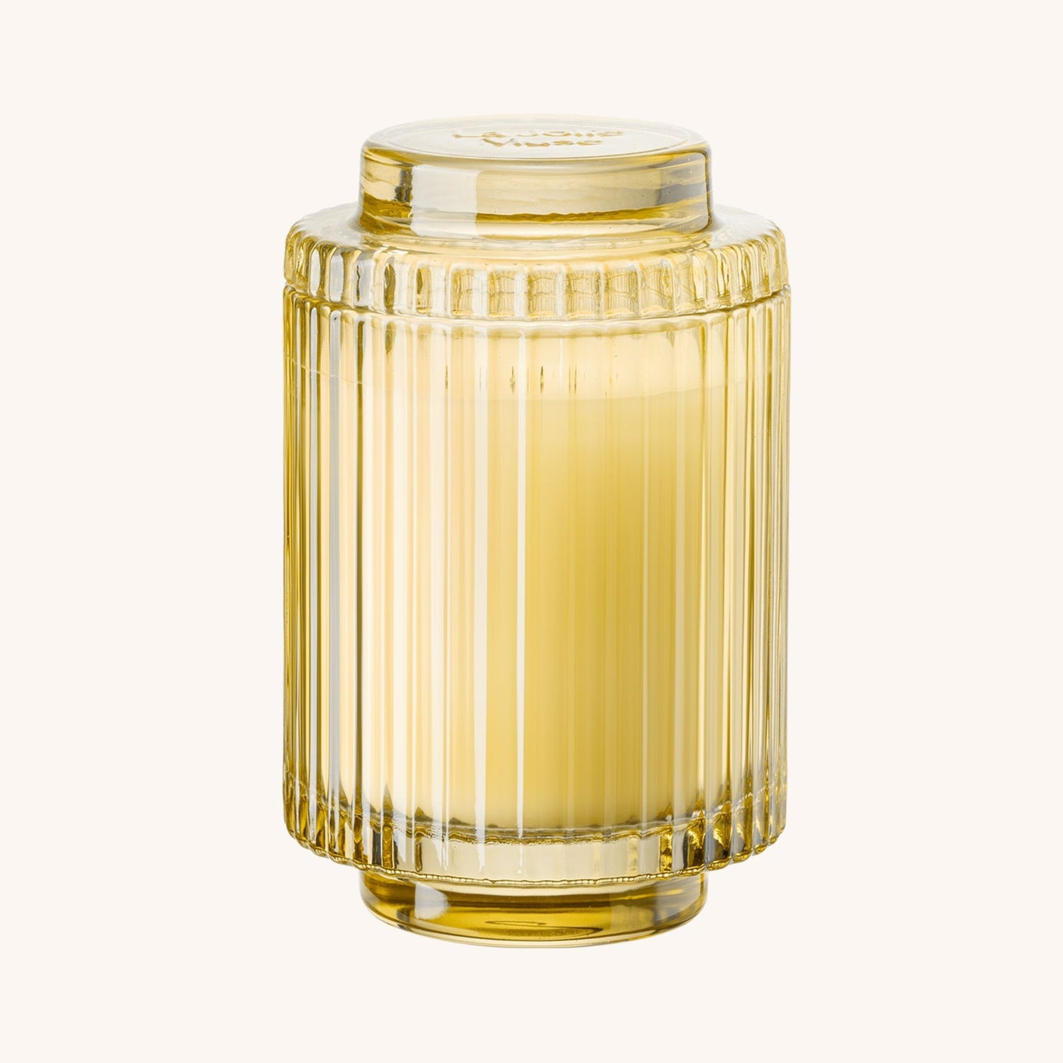 Yellow glass vase with ribbed design on a white background